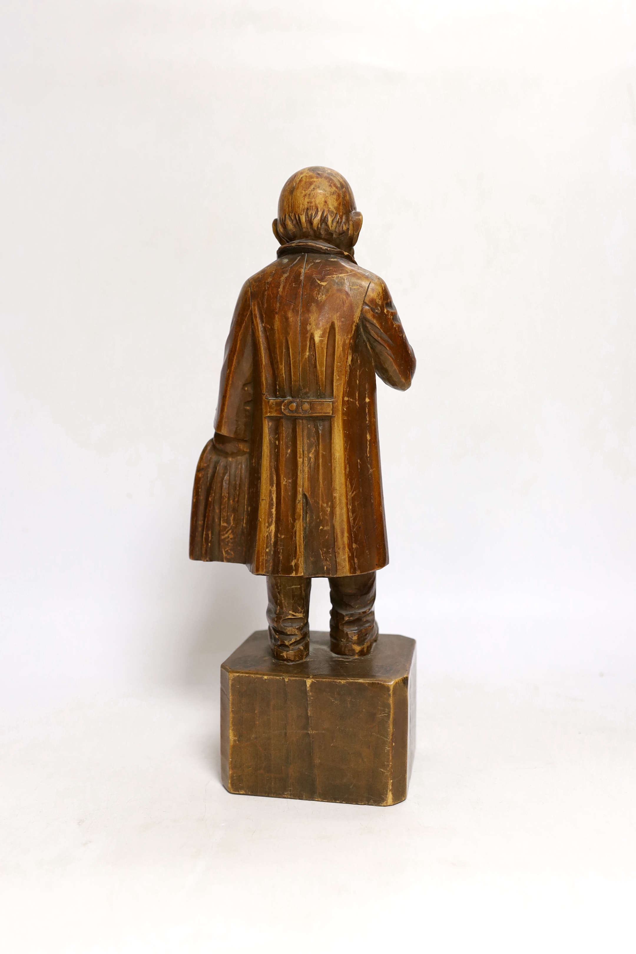 A German carved wood figure of a man, 28cm